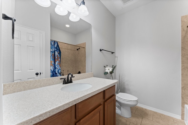 bathroom with tile patterned floors, toilet, vanity, and walk in shower