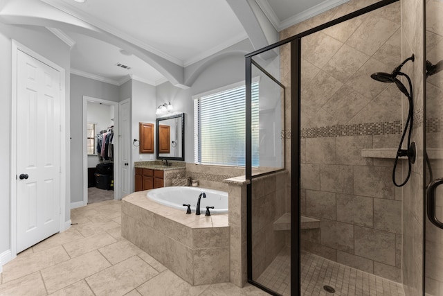 bathroom featuring tile patterned floors, vanity, separate shower and tub, and crown molding