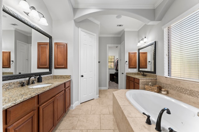 bathroom featuring vanity, a relaxing tiled tub, a wealth of natural light, and crown molding