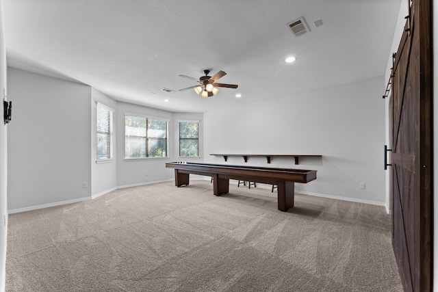 recreation room with light carpet, ceiling fan, and billiards