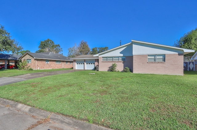 ranch-style home with a front yard and a garage