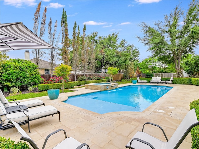 view of swimming pool with an in ground hot tub and a patio