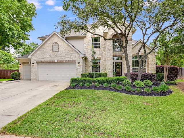 view of front of house featuring a front yard and a garage