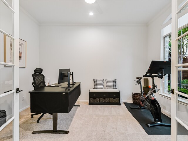 carpeted office featuring ornamental molding and french doors