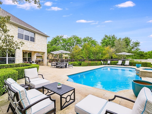 view of swimming pool with a patio