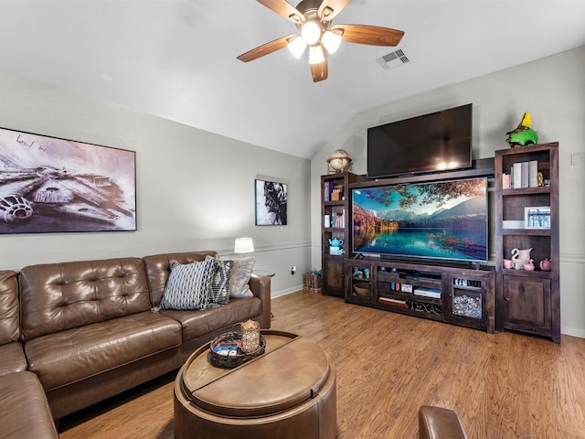 living room with light hardwood / wood-style flooring, ceiling fan, and lofted ceiling