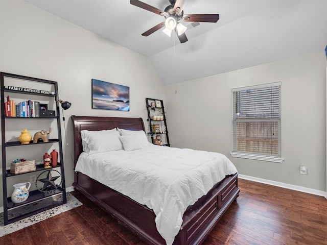 bedroom with vaulted ceiling, ceiling fan, and dark wood-type flooring