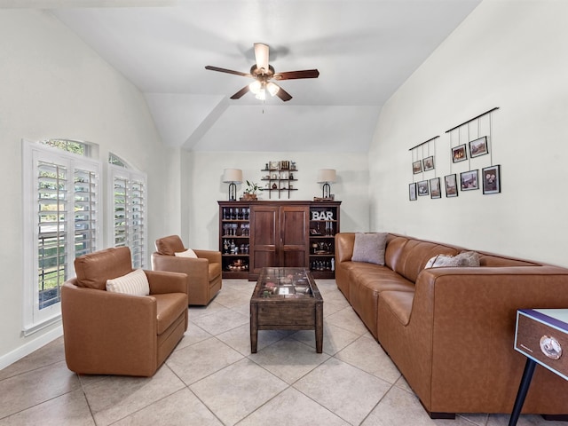 tiled living room featuring vaulted ceiling and ceiling fan