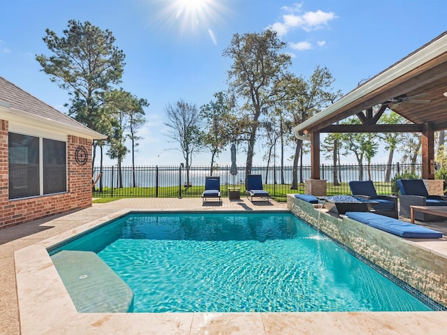 view of swimming pool featuring a patio area, ceiling fan, and pool water feature