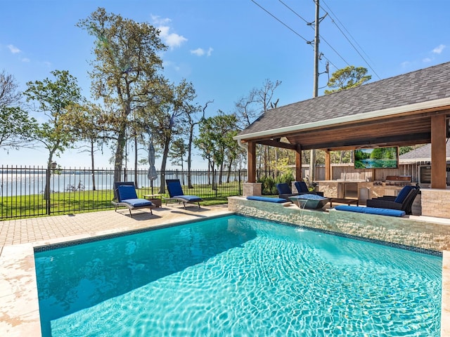 view of pool with a gazebo, area for grilling, a water view, and a patio