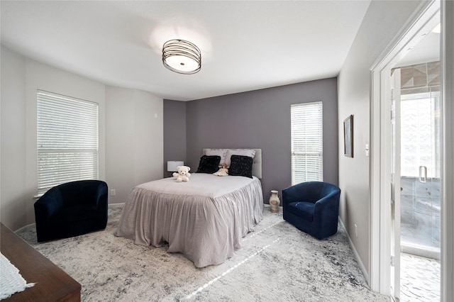 carpeted bedroom featuring multiple windows