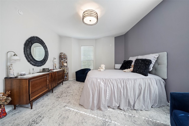 bedroom featuring light carpet