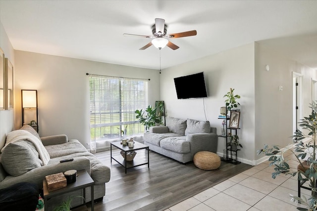 living room with ceiling fan and light wood-type flooring