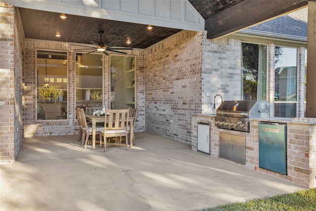 view of patio / terrace with ceiling fan, exterior kitchen, and grilling area