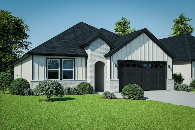 view of front of home featuring a garage and a front lawn