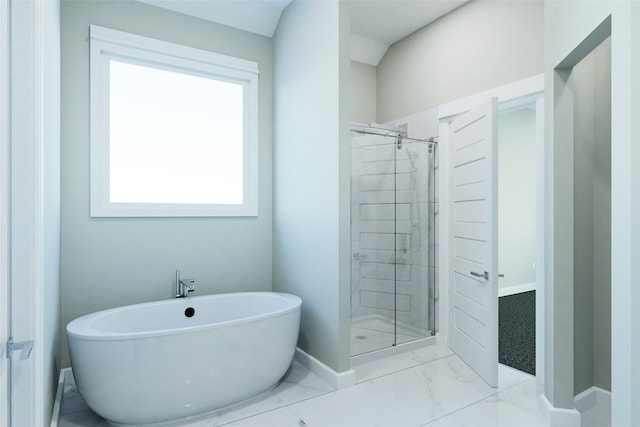 bathroom featuring plus walk in shower and lofted ceiling