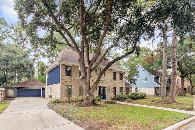 view of front facade featuring a front yard and a garage