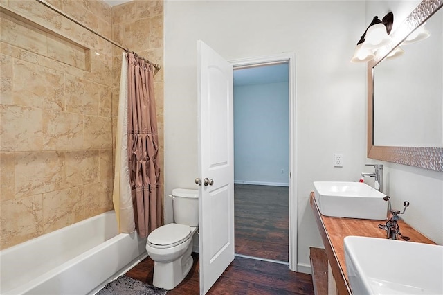 full bathroom with toilet, vanity, shower / bath combination with curtain, and hardwood / wood-style flooring