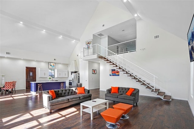 living room with sink, high vaulted ceiling, and hardwood / wood-style flooring