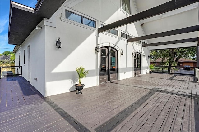 wooden deck featuring french doors