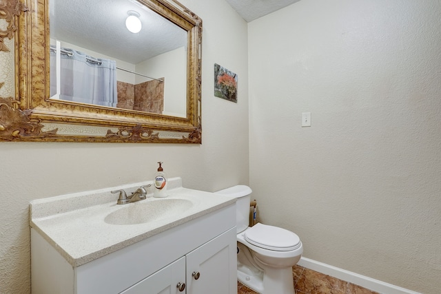 bathroom with walk in shower, tile patterned floors, a textured ceiling, toilet, and vanity