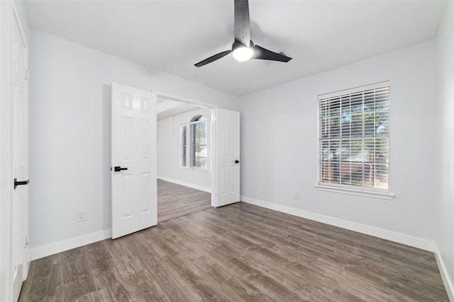 interior space with ceiling fan, plenty of natural light, and hardwood / wood-style flooring