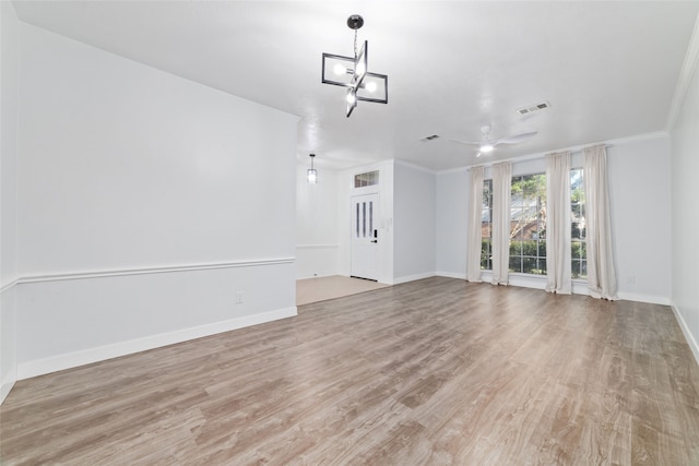 unfurnished living room featuring ceiling fan, light hardwood / wood-style flooring, and ornamental molding