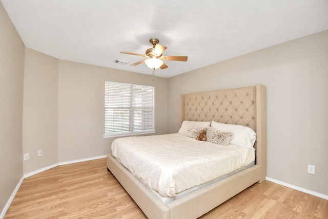 bedroom featuring light wood-type flooring and ceiling fan