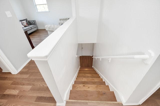 staircase featuring hardwood / wood-style flooring