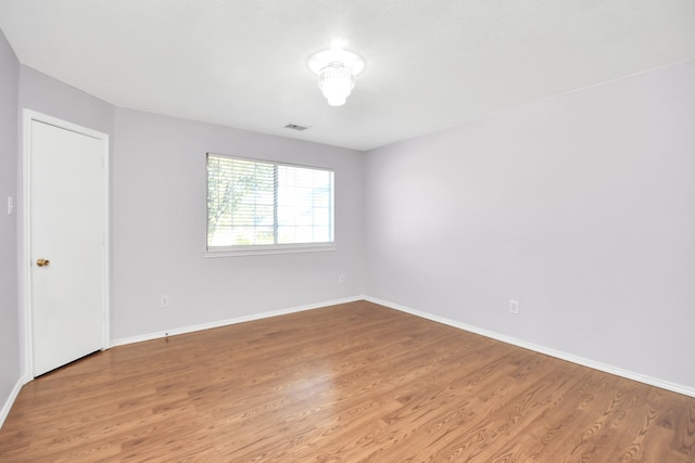 empty room featuring wood-type flooring