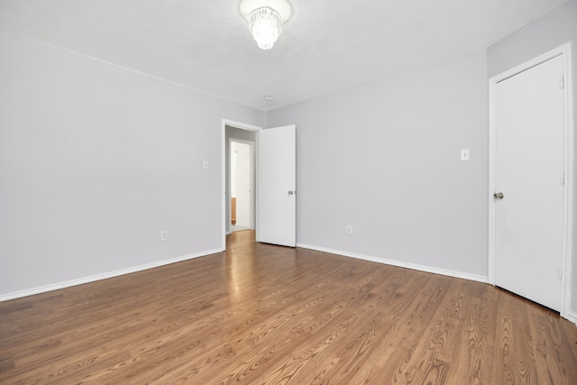 spare room with hardwood / wood-style flooring