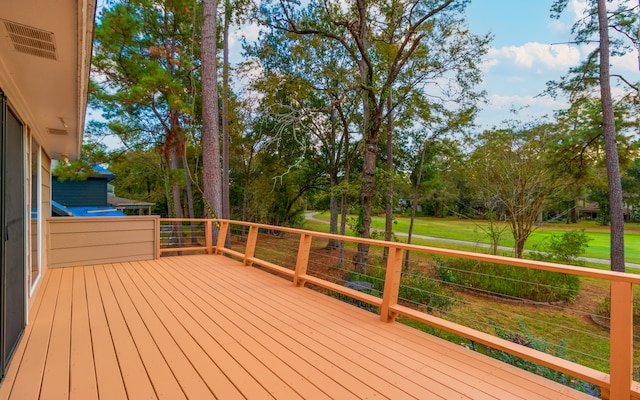 deck featuring a lawn