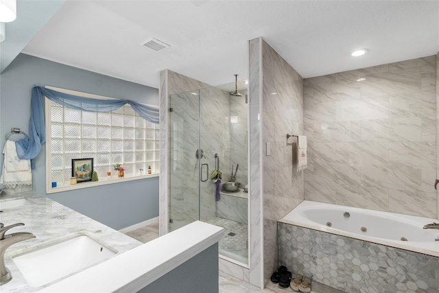 bathroom featuring vanity and separate shower and tub