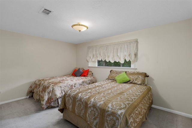 bedroom featuring light colored carpet