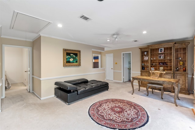 living area featuring ceiling fan, crown molding, and light colored carpet