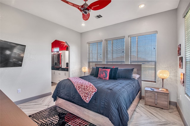 bedroom with ceiling fan and light parquet flooring