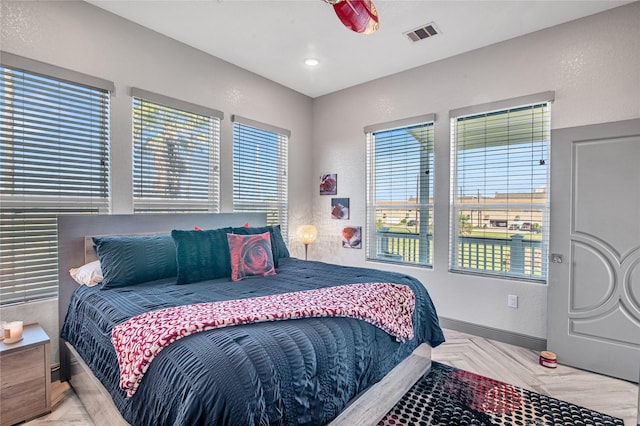 3709 Rice St, Galveston, TX 77554 - bedroom with multiple windows and baseboards