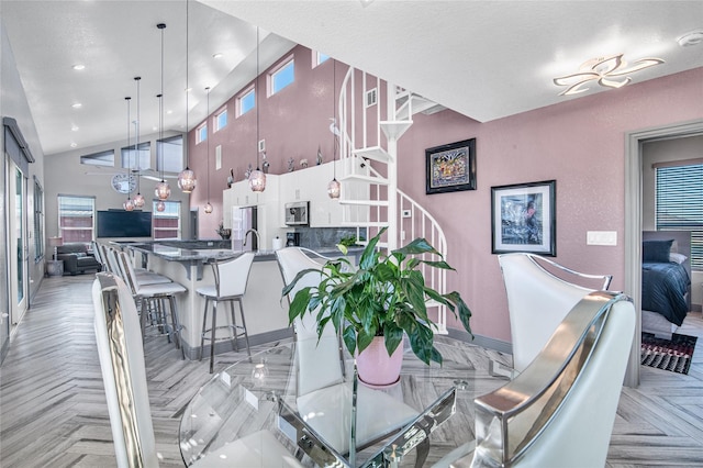 3709 Rice St, Galveston, TX 77554 - dining space with baseboards, stairway, recessed lighting, and a high ceiling