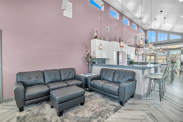 3709 Rice St, Galveston, TX 77554 - living area featuring baseboards, plenty of natural light, recessed lighting, and high vaulted ceiling