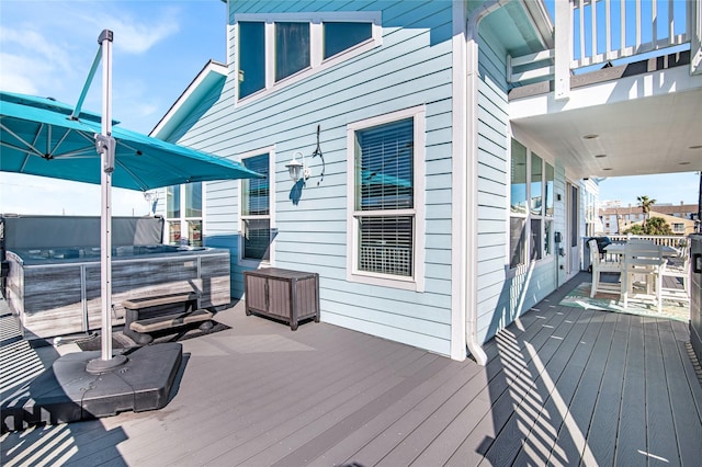 3709 Rice St, Galveston, TX 77554 - wooden terrace with a hot tub and outdoor dining space