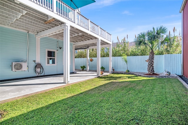 view of yard featuring ac unit, a patio, and a deck