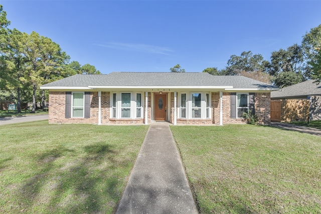 single story home featuring a front lawn