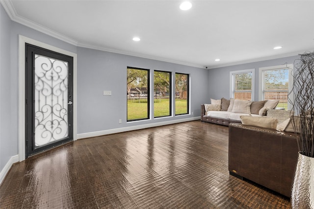 unfurnished living room with dark hardwood / wood-style floors and ornamental molding