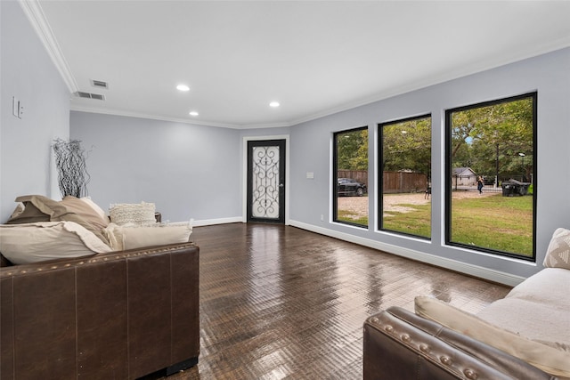 living room with dark hardwood / wood-style flooring and crown molding