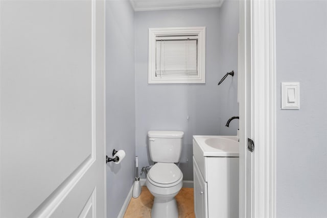 bathroom featuring tile patterned floors, vanity, and toilet