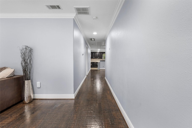 hallway featuring dark hardwood / wood-style flooring and ornamental molding