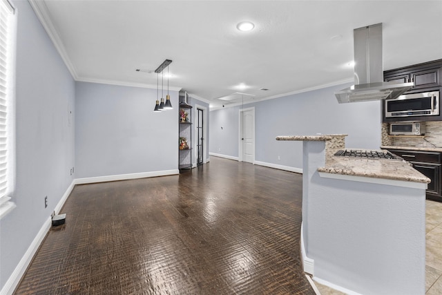 kitchen featuring island range hood, crown molding, stainless steel appliances, and tasteful backsplash