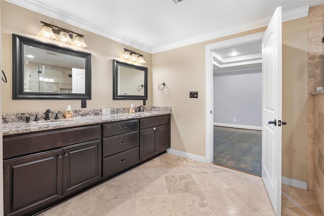 bathroom with tile patterned floors, vanity, and crown molding