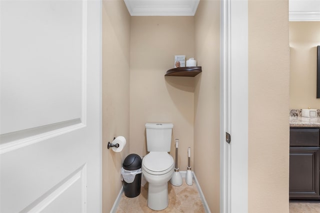 bathroom featuring tile patterned floors, vanity, toilet, and ornamental molding