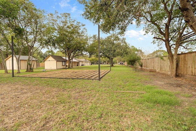 view of yard with a storage unit